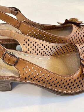 Alexis Leroy Perforated Flower Heeled Sandals in Brown & Tan leather